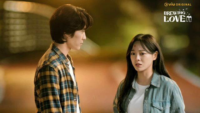 Lee Jong Won & Kim Se Jeong from the 2024 South Korean drama "Brewing Love." He is standing in a flannel shirt looking at her, wearing a denim shirt. She seems to be distressed.