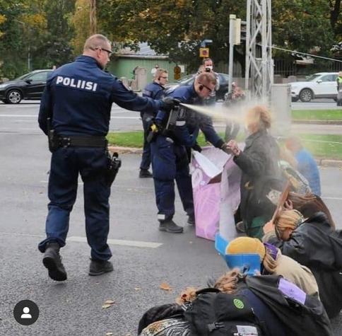 Finland Extinction Rebellion protesters get pepper sprayed by police.