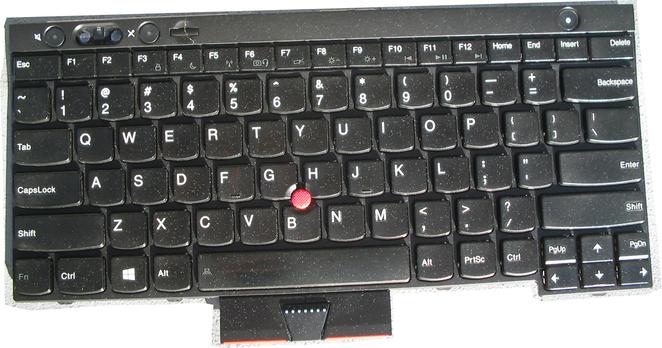 A ThinkPad T530 keyboard, removed from the body of the laptop, being offered