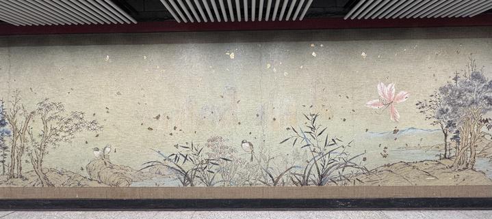 a tiled wall, with traditional Chinese landscape art
