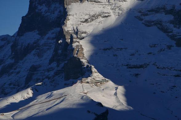 Eigergletscher train station in a shadowy rock and snow play