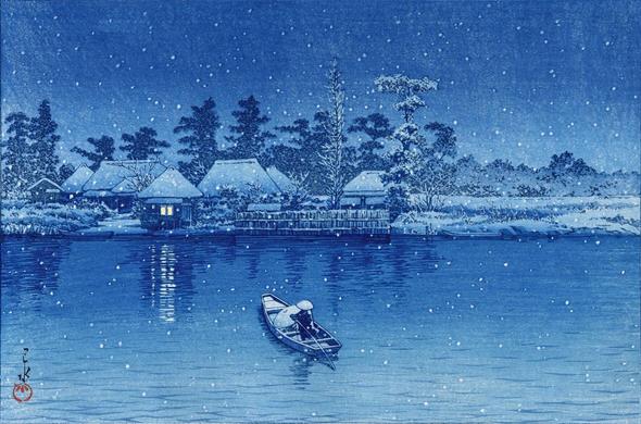 Snow falls as evening settles on a riverbank. A single pilot steers an small open wooden boat across a river, their solitary passenger sheltering under a wide bamboo umbrella. The little ferry is headed toward a small landing on the far side of the river, where a handful of traditional thatched-roof houses crowd in close beneath trees. The houses, the trees, and the fields beyond carry a layer of fresh snow, and snow continues to fall across the scene. Above, the sky is dim and overcast. Apart from a light glowing in the window of one of the houses, the image is rendered in shades of cool blue.