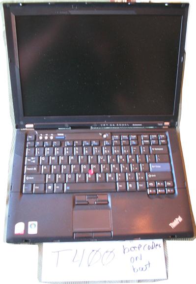 An open ThinkPad T400, showing the keyboard and LCD screen