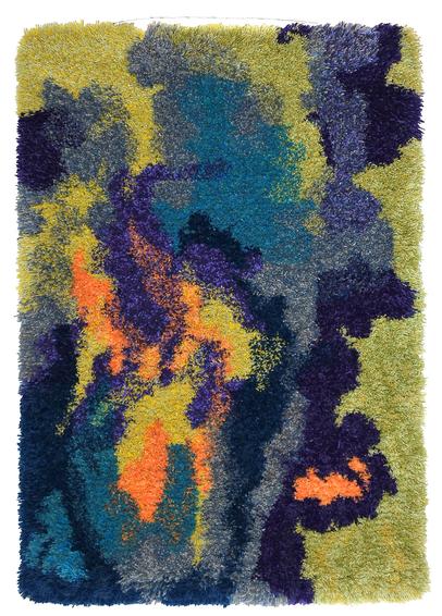 A thick-pile wall-hanging rug, known in Finnish as a ryijy, is hanging against a blindingly white wall. The rug is predominately a yellow-green composition, with clouds of blue, grey, and dark violet blending into central flame shapes in yellow and orange.