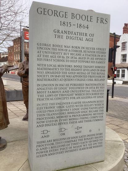 Memorial to the mathematician George Boole on the forecourt of the railway station in Lincoln - stone slab setting out the significance of Boole’s work