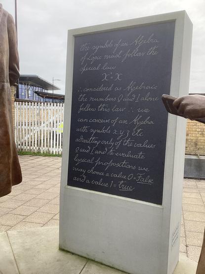 Memorial to the mathematician George Boole on the forecourt of the railway station in Lincoln - text setting out the basics of Boolean algebra
