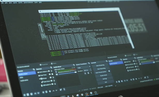 A computer monitor is displaying OBS Studio on the background anda terminal window on the foreground. In the terminal, there's calls to "systemctl status" and "systemctl stop" of services dome@1.service and dome@7.service. The terminal host is pi@pentucam64.
