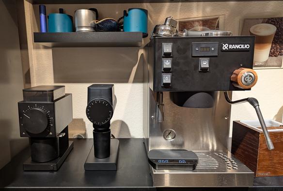 A view of my current setup (f.l.t.r.):
Fellow Ode 2.0 black (actually modded to a 2.0) for pour-over
Timemore Sculptor 064s black for espresso
A Rancilio Silvia Pro X black dual boiler portafilter machine with a walnut steam knob

Also some brewing equipment like a Weber Workshops blindshaker, 3d printed portafilter holder, dosing cup and tiny spritz bottle on a shelf behind the machine.