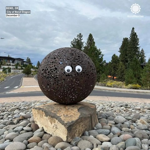 Big round circle sculpture with googly eyes