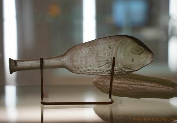 Roman glass vessel in the shape of a fish, made of translucent glass