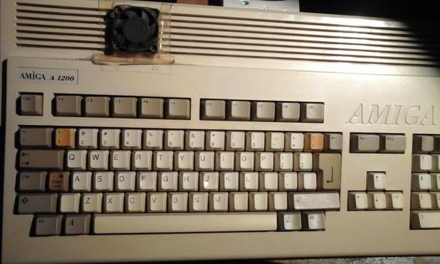 A1200 Amiga computer with a small cooling fan on top of the HDD area