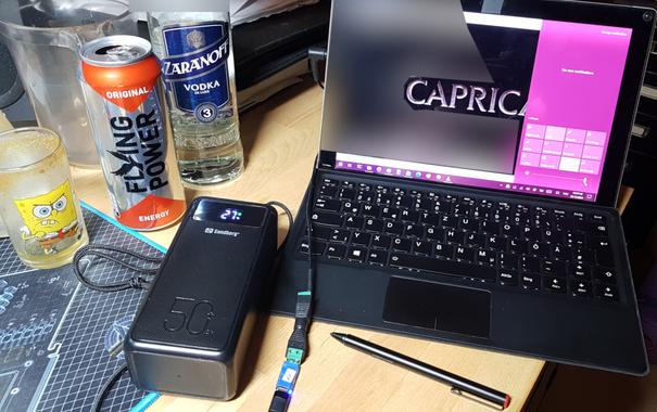 The little blue thing is a USB-C PD decoy/trigger board, feeding my tablet at 20 volts - i've talked about that in a recent toot. (I've also blurred the reflection of my naked torso, for your convenience - you're welcome. ;)