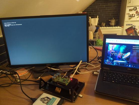 A computer screen, with a text login prompt. A laptop, showing volumio running internet radio. 
A raspberry pi, and an external harddrive.