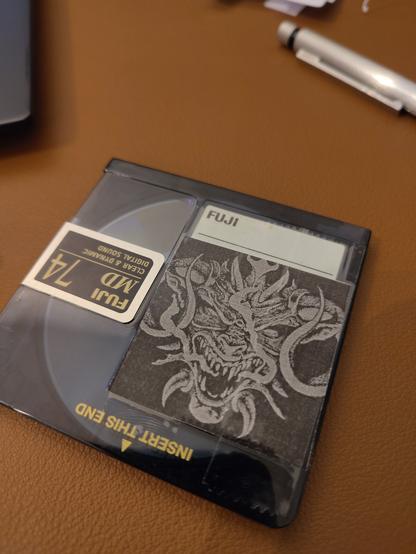 Minidisc with black and white cover art fr the diablo tribute album
