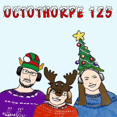 John wears an Octothorpe Christmas jumper and a green and red hat with elf ears, Alison wears a red Christmas jumper and a moose/reindeer hat, and Liz wears a blue jumper and a Christmas tree hat. The words “Octothorpe 125” appear at the top in a Christmassy font that looks like it has snow on the letters.