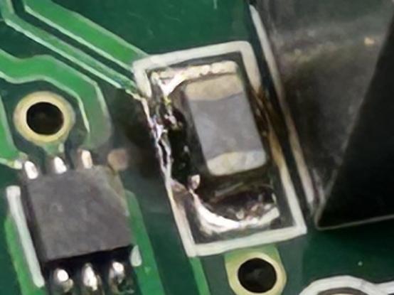 Closeup of the ground filter that hangs off the USB ground pin. It’s charted on the sides and on the board.