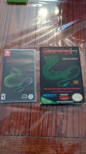 Photo of copies of Wizardry: Proving Grounds of the Mad Overlord, with the Switch version on the left and the NES version on the right.