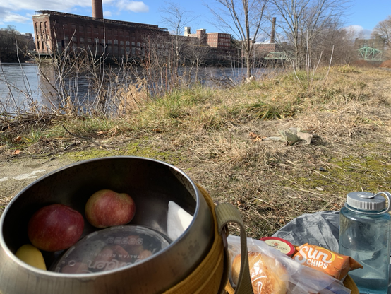 Eating a meal by the Merrimack River in Lowell.