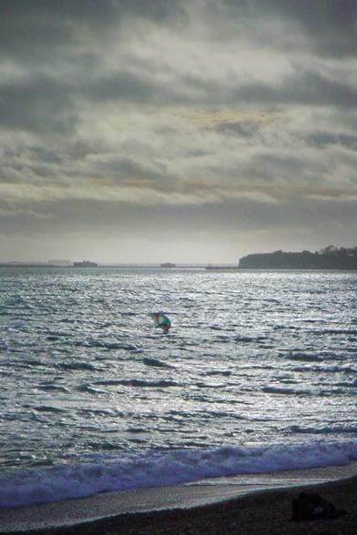 Grainy picture of a wing surfer