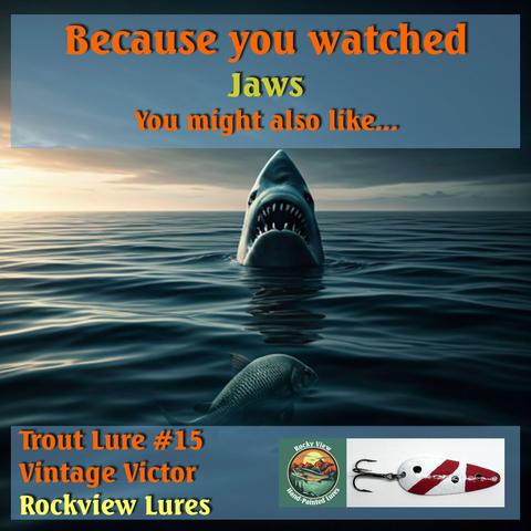 A fishing lure advert showing a great white shark and a fishing lure.