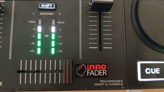 Denon Prime Go DJ unit close up photo, showing cross-fader with Innofader sticker.