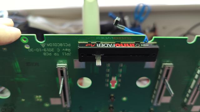 part of a circuit-board from DJ controller, showing a "mini innofader" replacing the stock Denon fader.