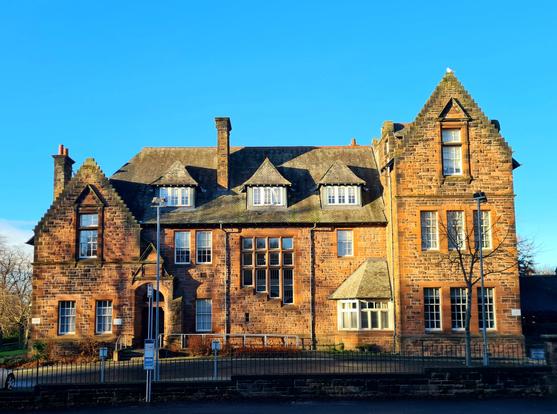 A 17th Century style red sandstone former Victorian orphanage.