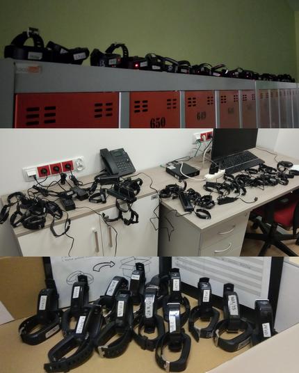 Three pictures of a bunch of electronic wristbands (proximity sensors). They are lined in a row on top of school lockers, charging on a desk, and standing in a box with the device IDs visible.