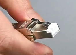 Photo of the connector with it's metal retention latch.