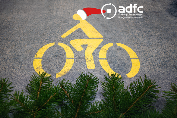 Fahrradpiktogram mit Weihnachtsmütze und Tannenzweigen
