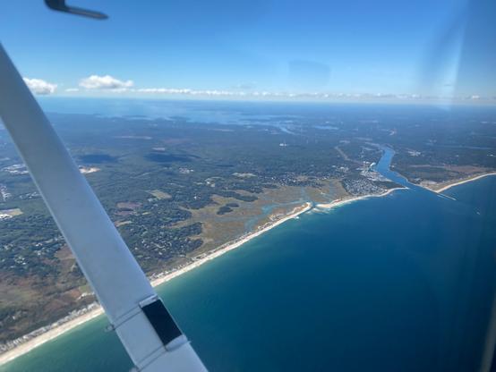Real life view from the Cessna 172 during my first ever solo cross-country. This is the Cape Cod canal on my way back to KOWD from KHYA, similar to the Google Earth screenshot view.