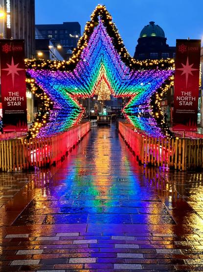 A star-shaped tunnel of lights.