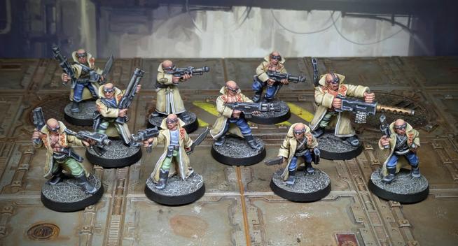 10 Necromunda Delaque gangers. Bald guys with various weapons