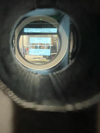 View through the viewfinder showing the artificial horizon, the pano mask, the light meter reading for the selected aperture (3.5), the current measured distance and the current lens focus distance.