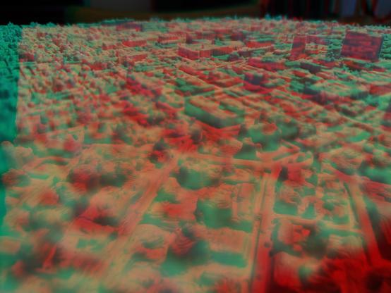 Extreme closeup of a white, 3D printed relief of Lancaster City, Pennsylvania. Presented as a Red/Blue Anaglyph stereoscopic image.
