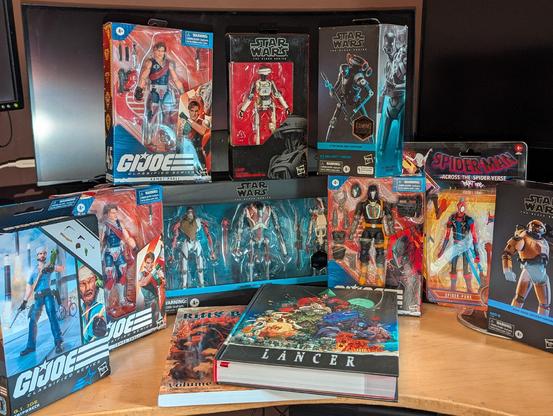 A bunch of action figure and a couple of ttrpg books I got for Christmas. 

GI Joe:
Tomax and Xamot
Shipwreck
Cobra BAT

Star Wars:
Tons of droids from video games and movies 

Hoby from Into the Spiderverse