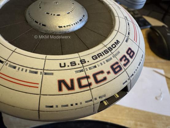 Closeup,of the saucer showing white a clear areas in the windows