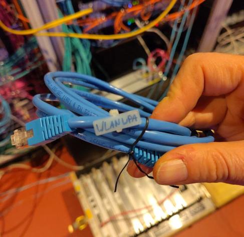 An ethernet patch cable with a label saying "WLAN WPA".