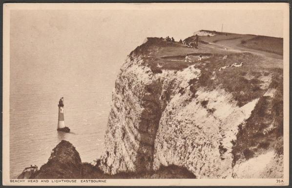 Printed sepia postcard showing a view of Beachy Head and the lighthouse at Eastbourne in Sussex.
Published by Shoesmith & Etheridge Ltd, Hastings, Norman Series, No 35A.
Postally used on 13 July 1956 with Eastbourne cancellation, stamp removed, and sent to Mr & Mrs Tod, 89 Beatrice Street, Swindon, Wiltshire.
Good condition, with slight corner bumps.