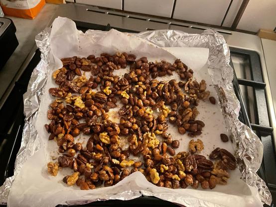 Baking tray full of spiced nuts.