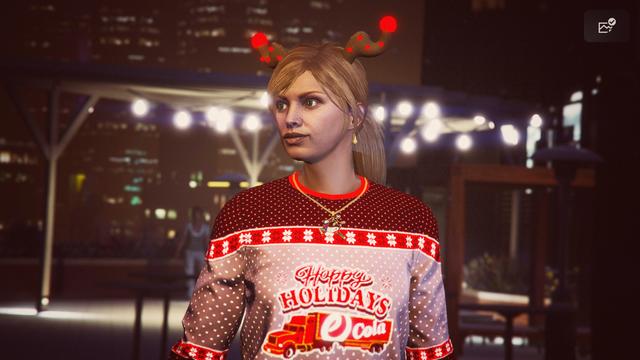 A screenshot I took in the video game GTA Online using the Rockstar Editor. It shows my second character (female) wearing the festive annual Christmas outfit with some decorative Christmas lights in the background.