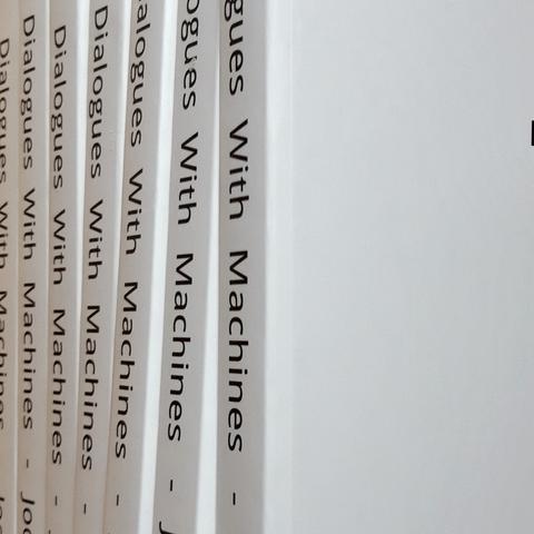 Partial view on a pile of printed Phd theses.