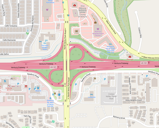 Freeway intersection which has a lot of evening bicycle and pedestrian traffic, but is NOT very friendly to either in the dark.