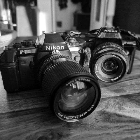 Black and white picture of a Nikon F-301 and a Nikon F-401S