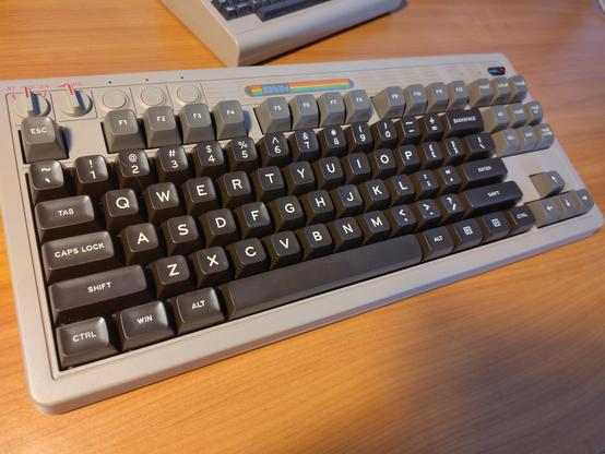 A 8Bitdo retro mechanical keyboard in the style of an original C64 bread bin case