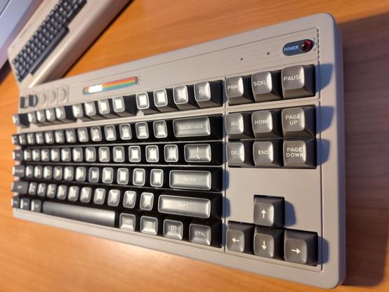 A 8Bitdo retro mechanical keyboard in the style of an original C64 bread bin case