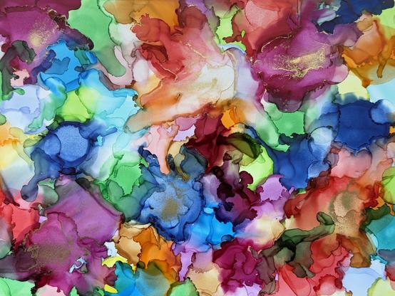 An alcohol ink painting using multiple colors that blend and overlap in a random, abstract way