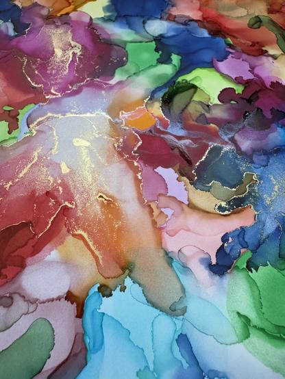 Detail of an alcohol ink painting, focusing on an area where gold ink was applied