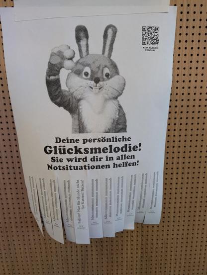 ein abreissblatt mit dem titel "deine persönliche glücksmelodie" und abrisszetteln mit dem text "Mmmmmmmmmmm mmmmmmmm mmmm mmmmmm mmnnh"