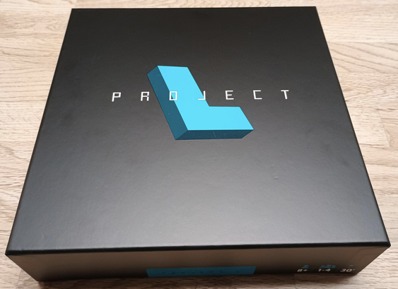 Photo of the box that is black and says "Project L"